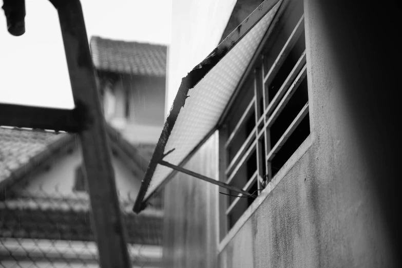 a black and white po of a window with bars in the front