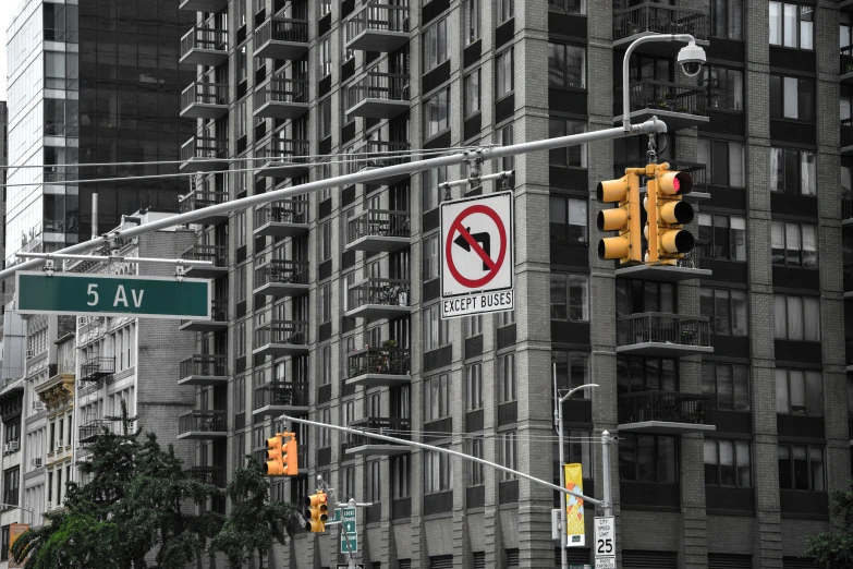 an intersection is shown with traffic lights and street signs