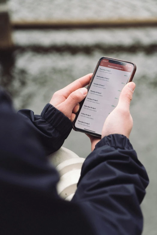 person holding up a smartphone in the hands