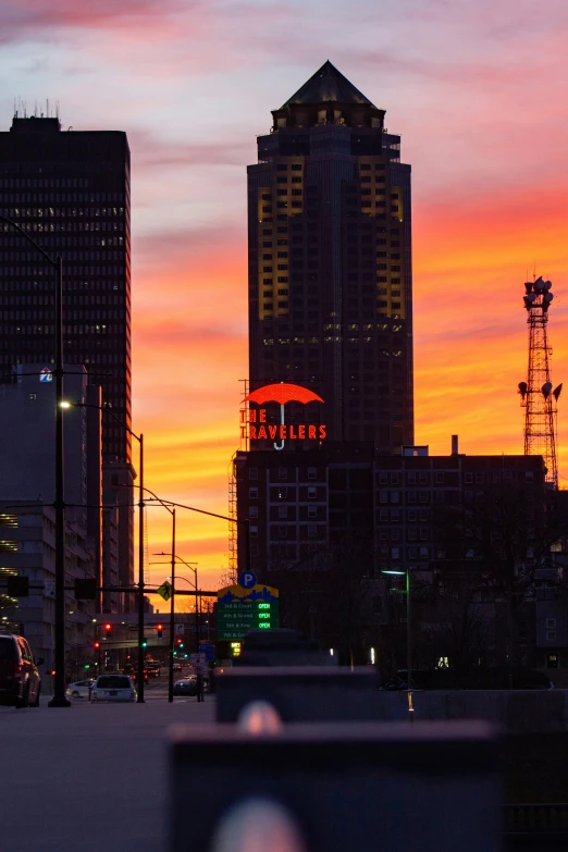 a city sunset with tall buildings and traffic