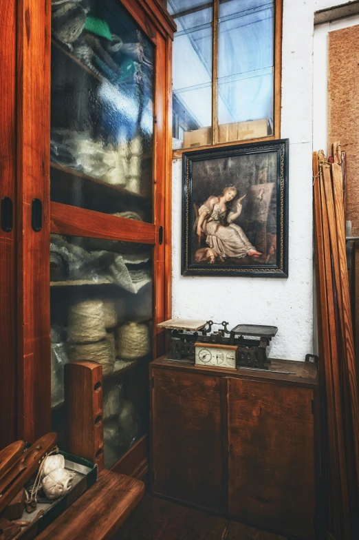 a picture of an old painting in the corner of a room