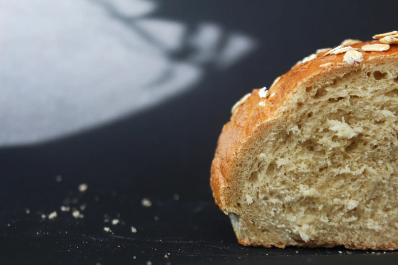 this loaf of bread has nuts on top of it