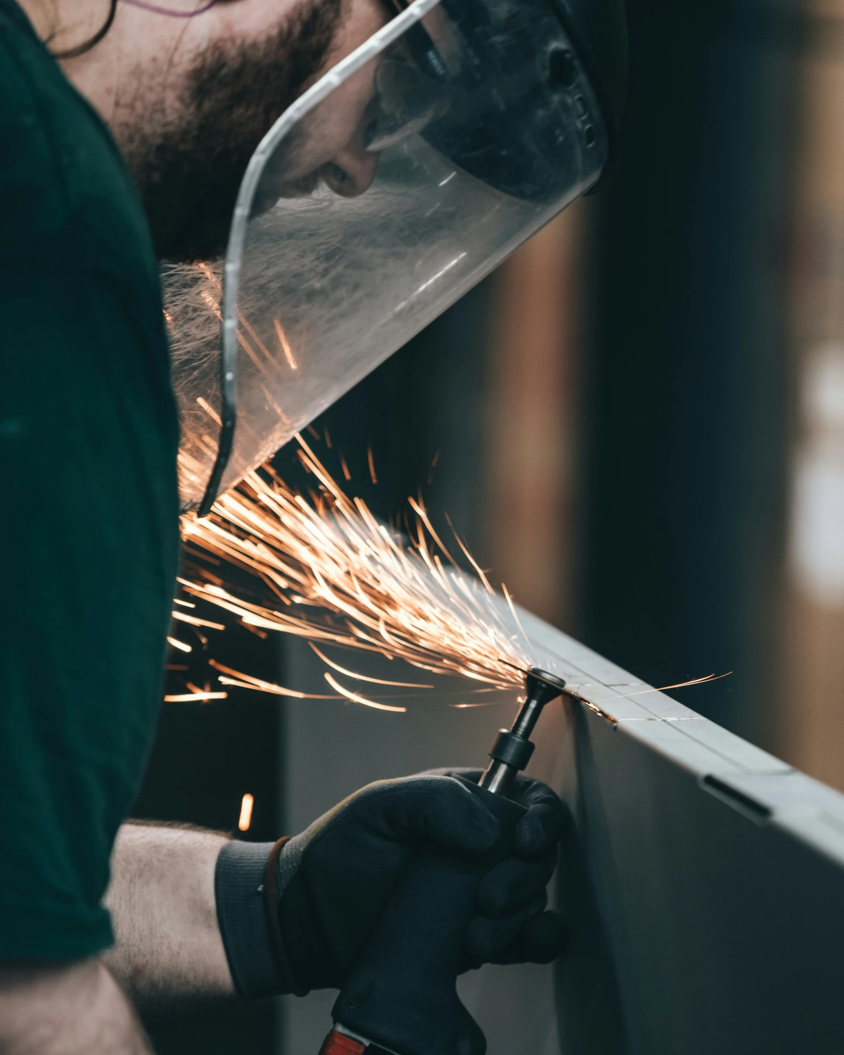 someone using a grinding machine on a table