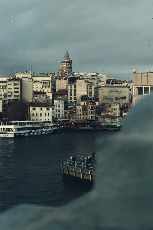 boats float through the water and beside buildings