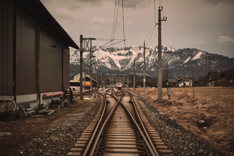 a rail road track in front of a building