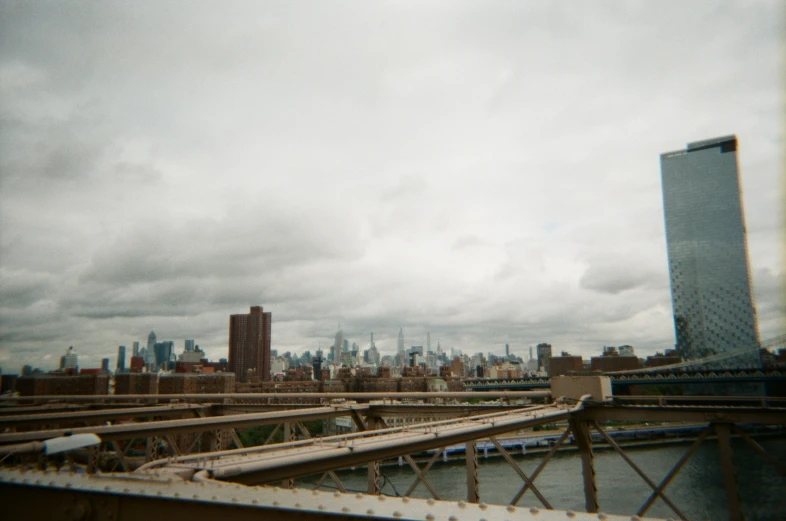 an overhead view of a city and bridge