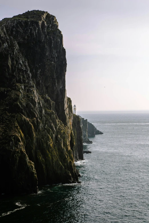 a body of water near large rocks in a bay