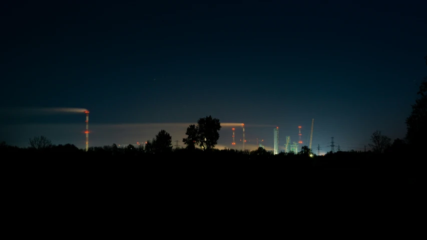some power lines and trees at night