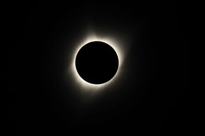 a total eclipse is seen over the horizon