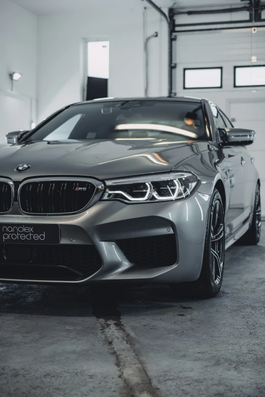 a bmw parked in a garage on the floor