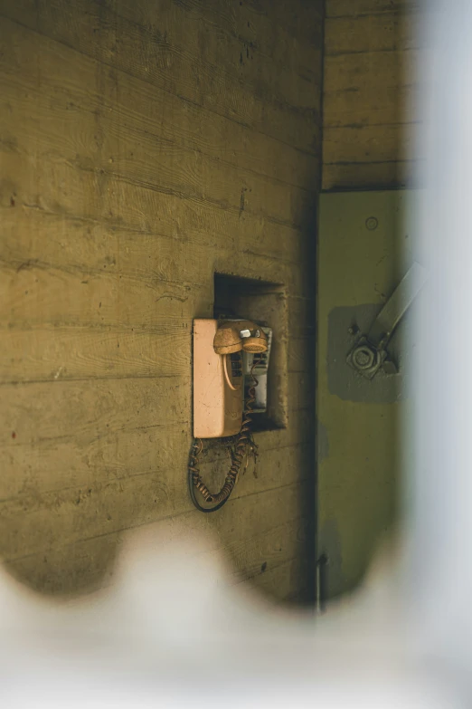 a phone on a wooden wall with no power