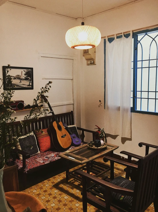 an open room has guitars hanging on the wall