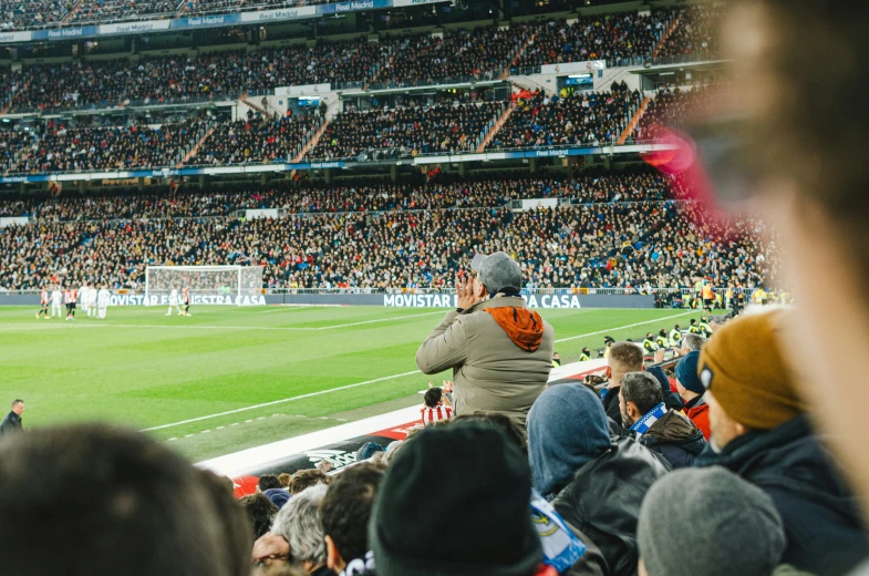 a man standing on top of a soccer field