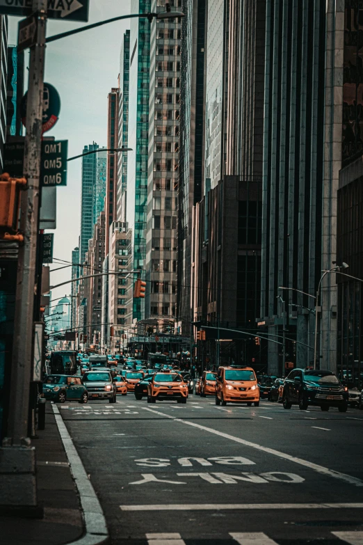 this is a city street with traffic stopped at an intersection