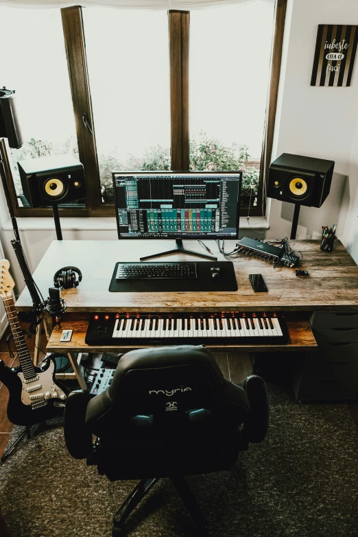 an electronics table in front of a big window