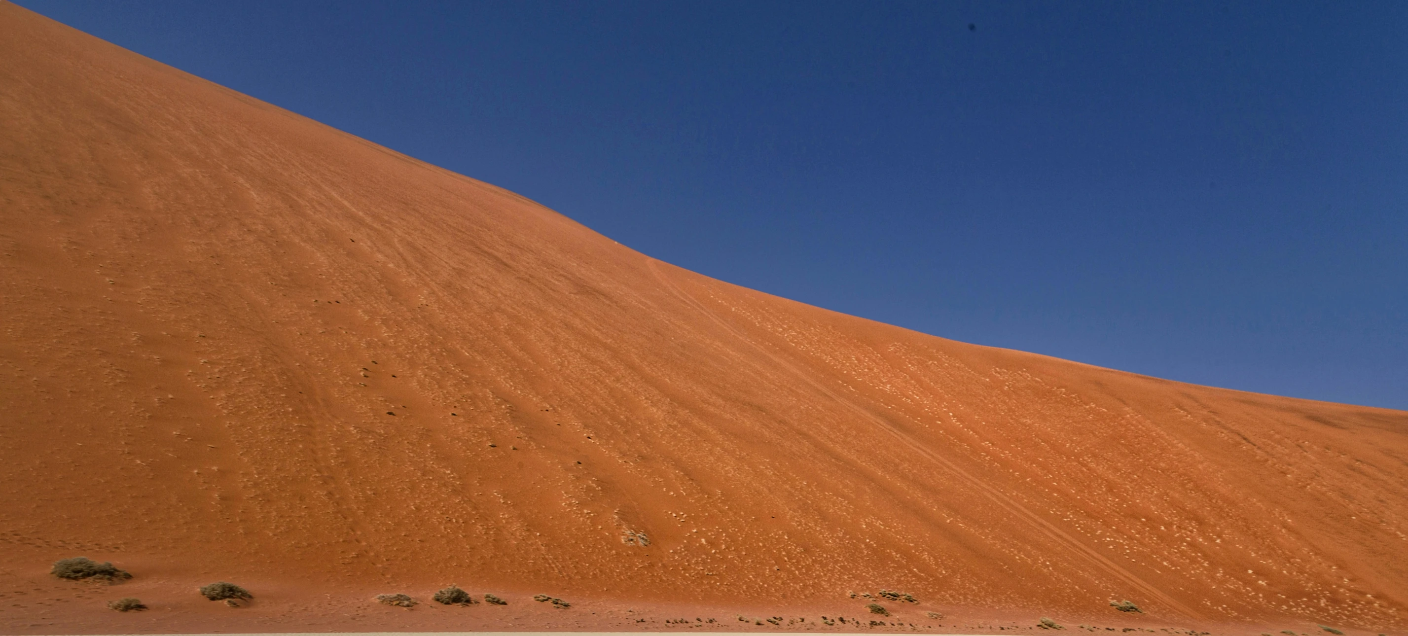 a dirt hill with a sky background