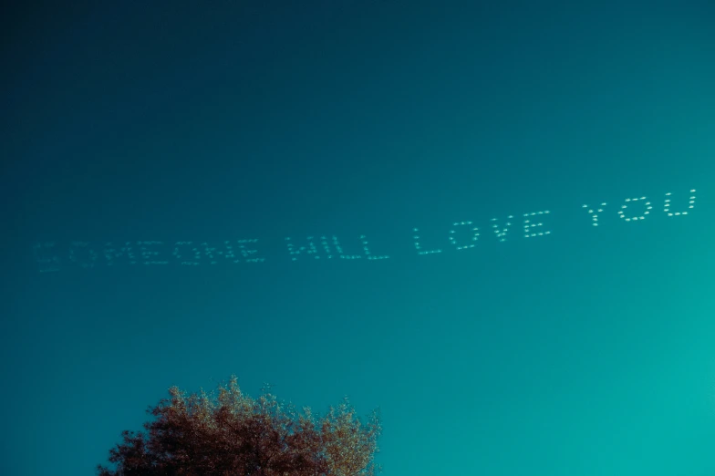 a big airplane is writing it in the air