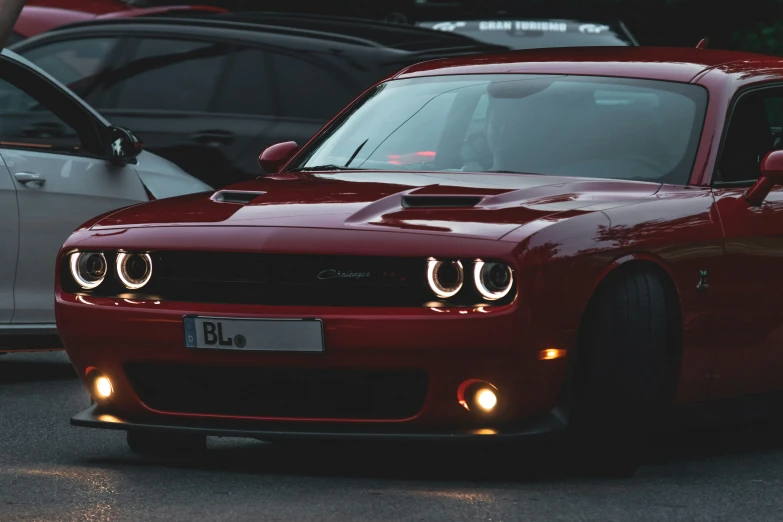 a red sport car that is being driven by someone