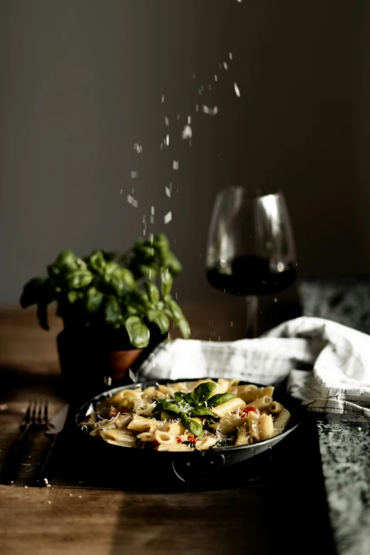 a plate of food and wine on the table