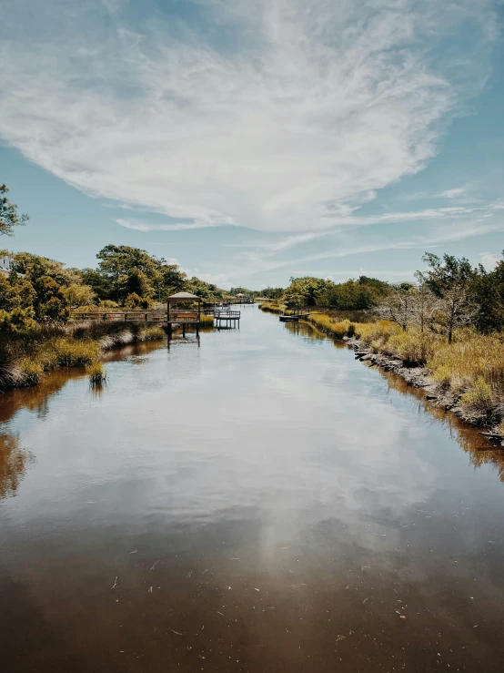 a large channel of water with benches along one side