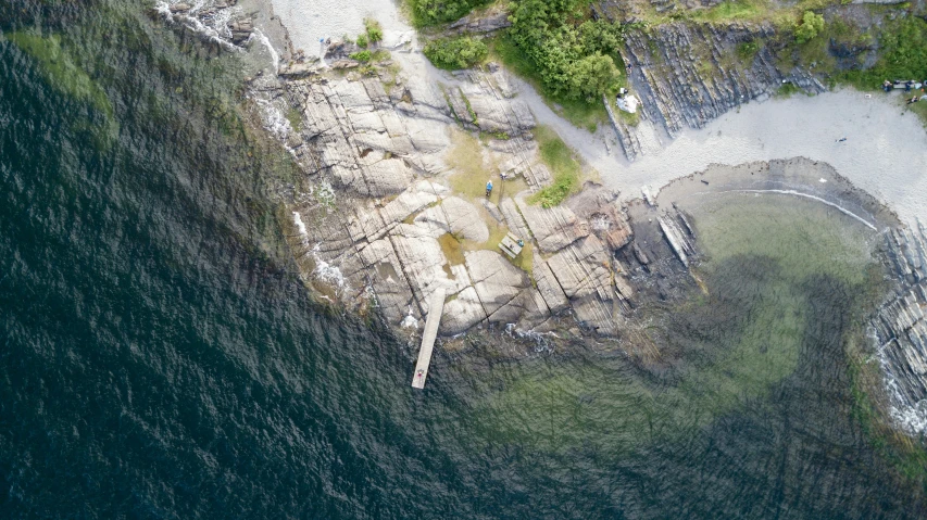 an old, run down dock is seen from above