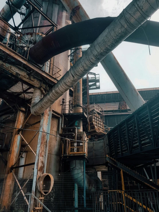 some pipes and pipes hanging from a very tall building