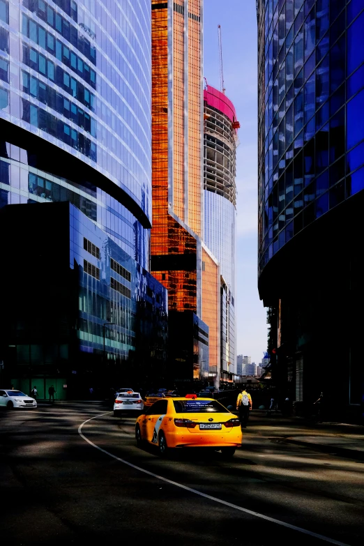 traffic on a city street with buildings in the background