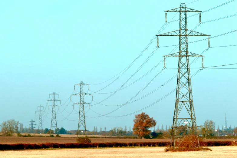 there is many electrical power lines that can be seen in the distance