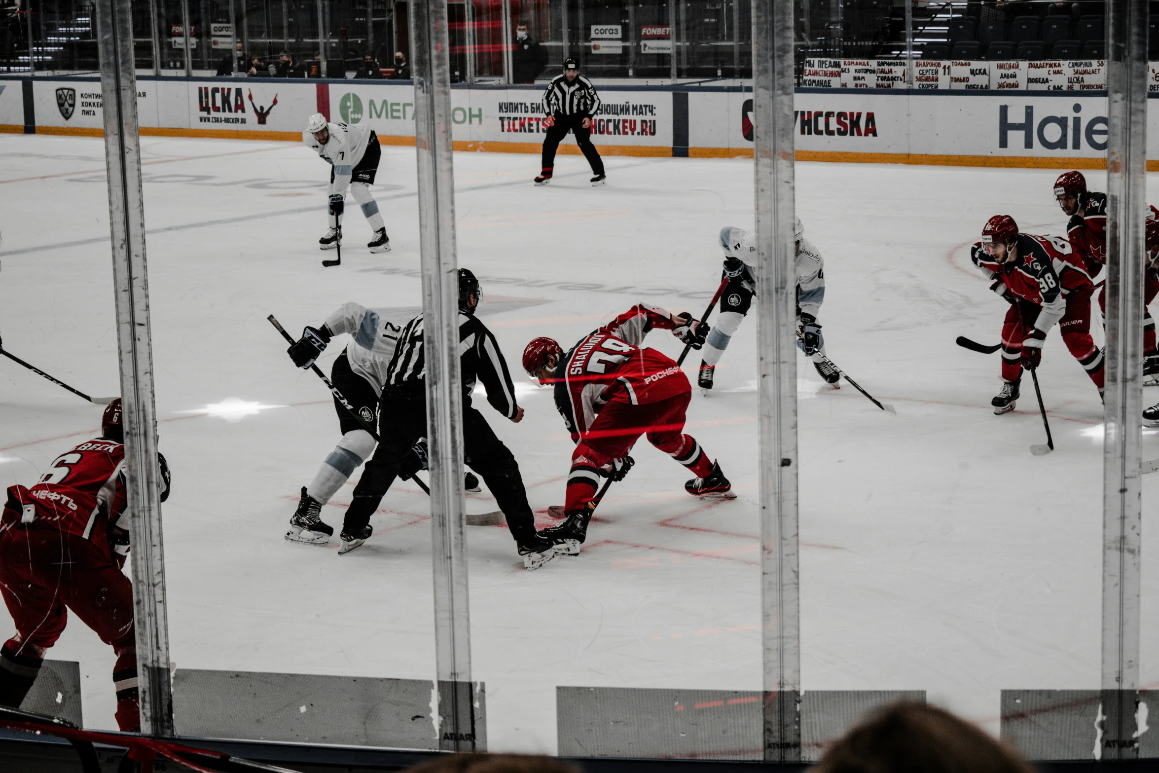 several hockey players in the middle of an ice hockey game