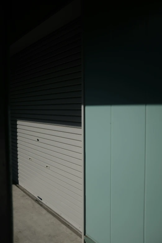 a self storage building with doors in the dark