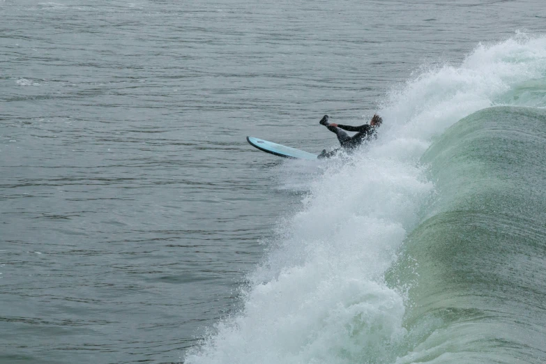 a surfer on a board riding a wave