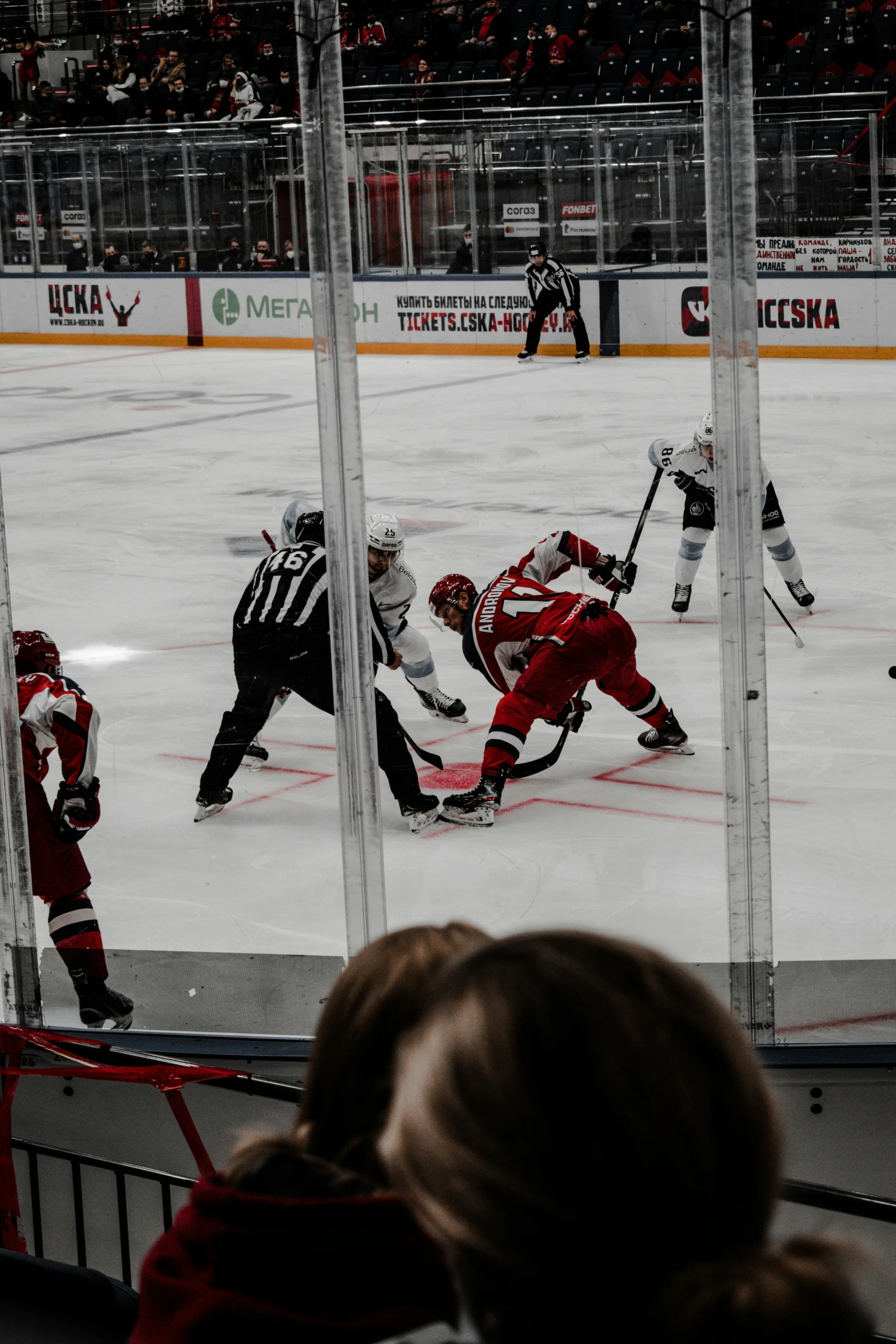 people are playing a game of hockey on the ice