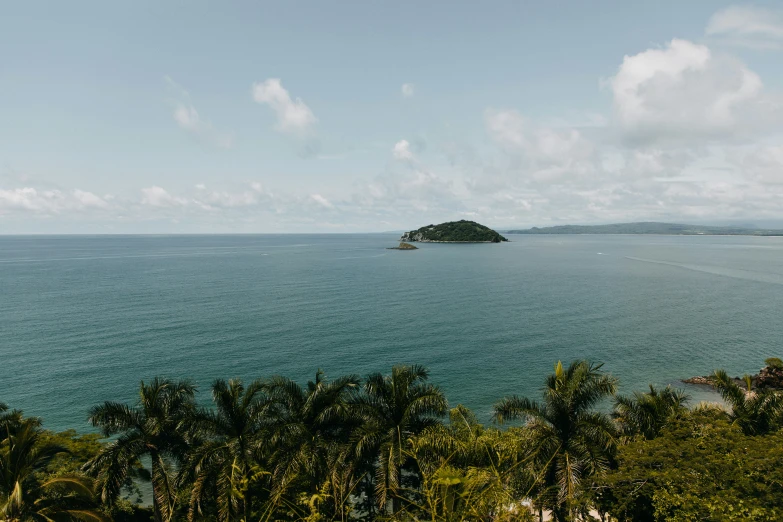 an island sits on the edge of the water