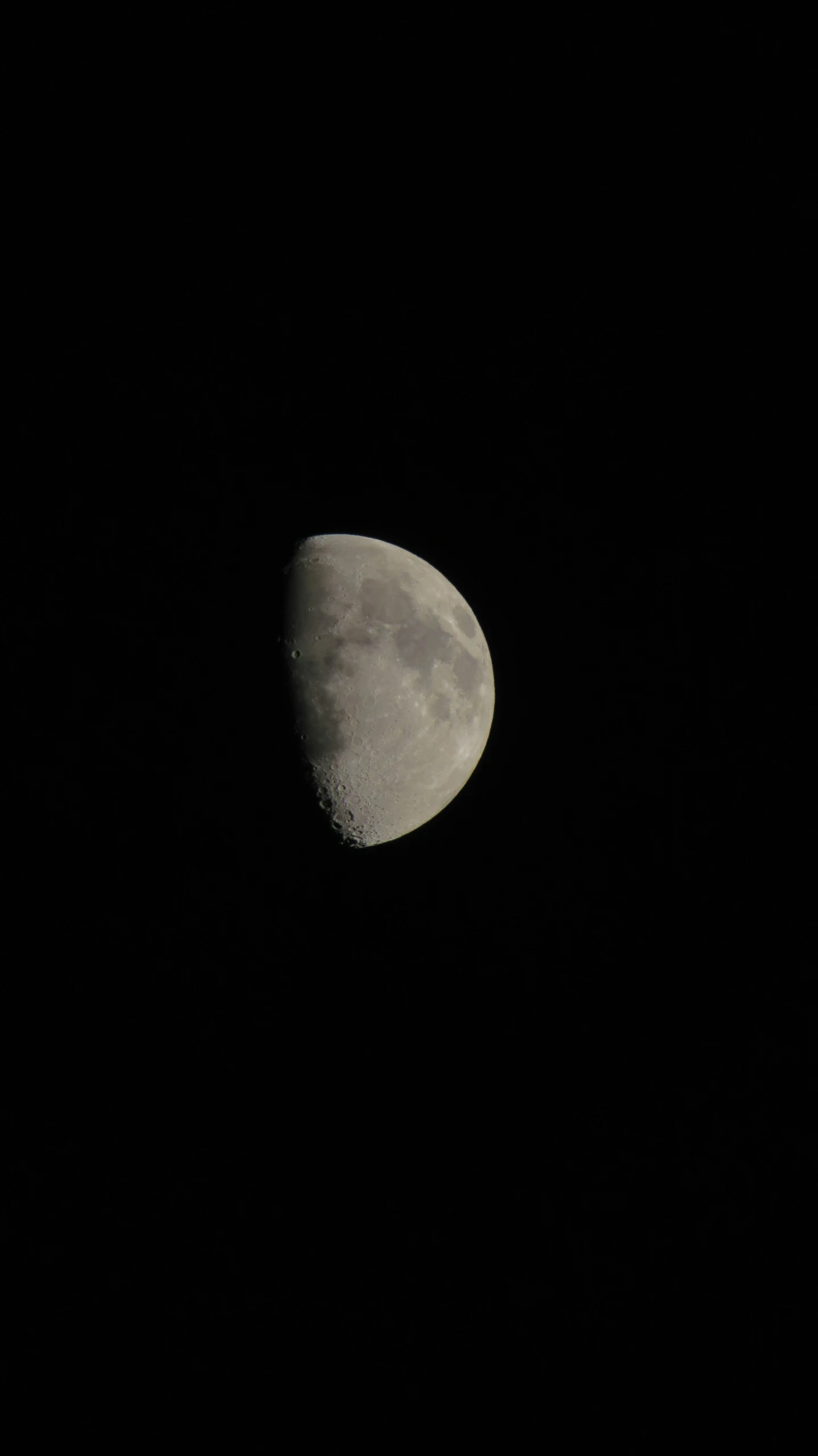 the moon has a dark background to show the moon's half - moon