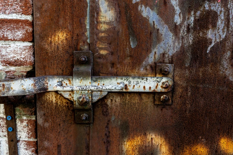 a rusty metal door is pictured in this image
