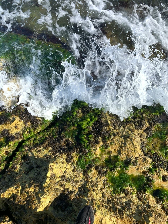 the water is getting very choppy on the rock