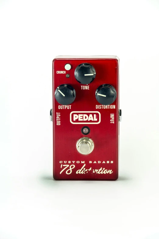 a red pedal overdrive sitting on top of a table