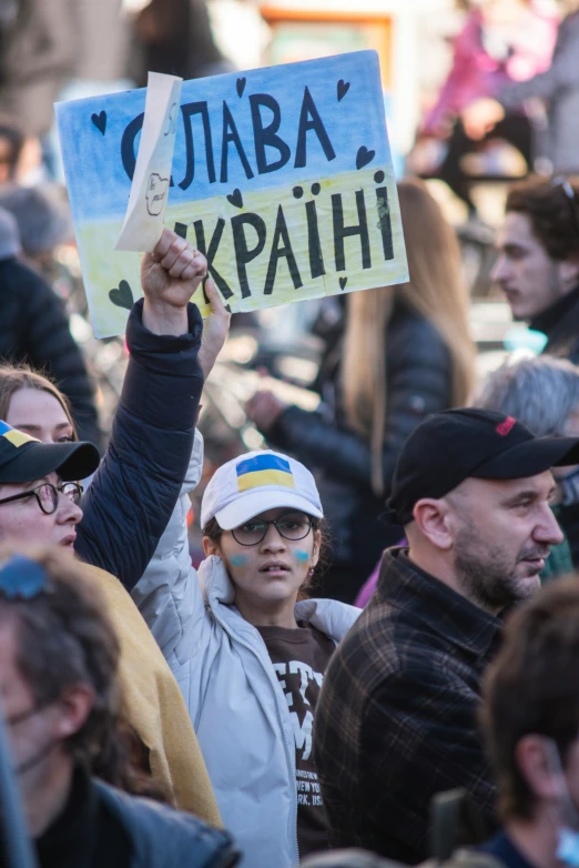 a bunch of people are standing together outside