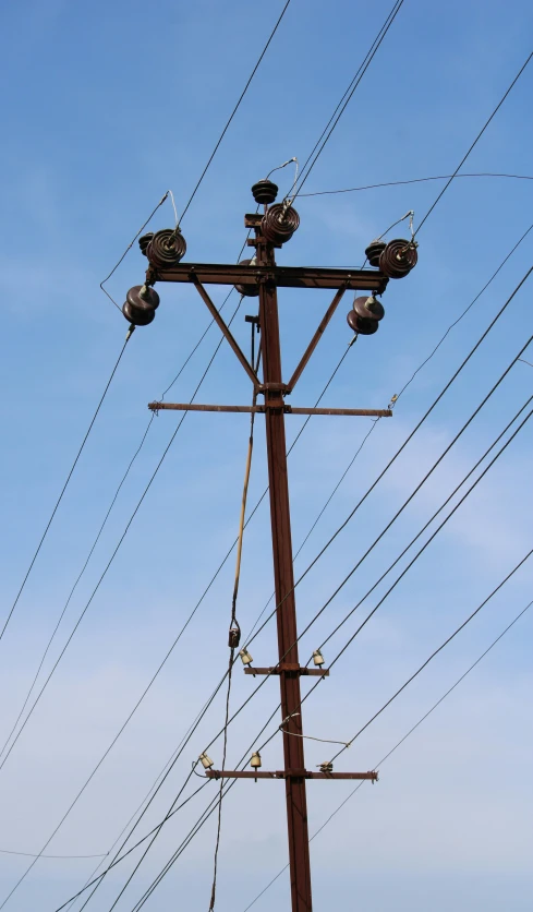 the old telephone pole is set to become electric wires