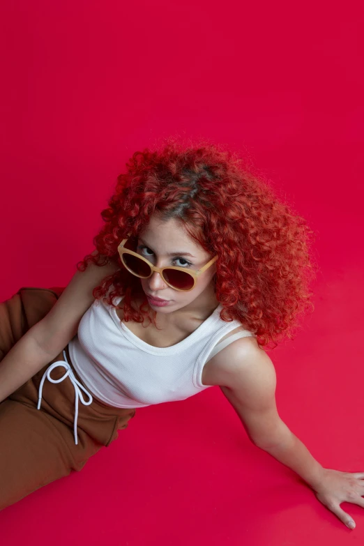 an image of a woman with curly red hair