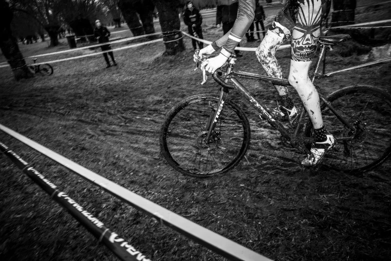 black and white pograph of a cyclist riding