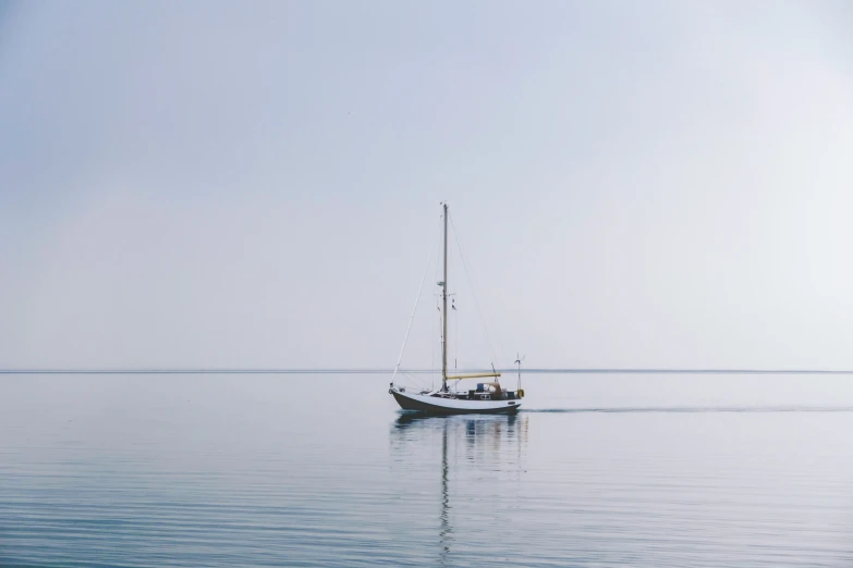 a small boat sitting in a large body of water