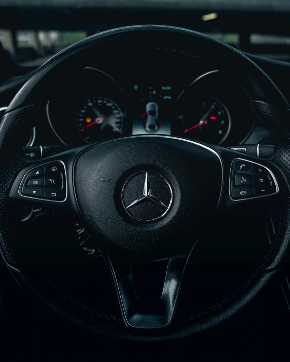 the dashboard and steering wheel of a mercedes c - class car