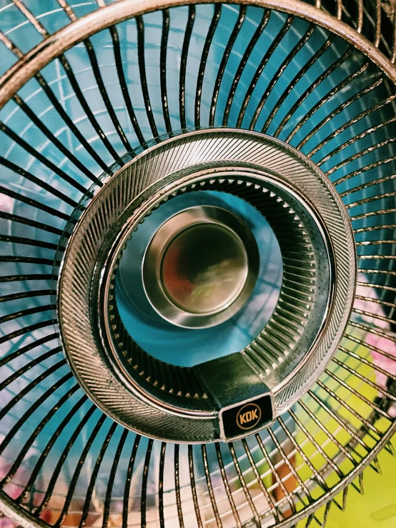 the top of a metal structure next to a painting