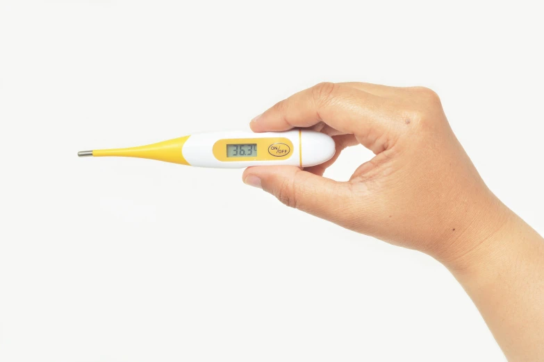 someone is holding a digital thermometer in their hand