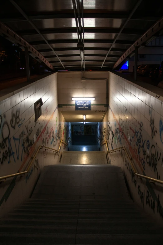 stairs covered in graffiti next to a set of steps