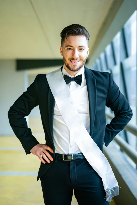 a man wearing a suit and bow tie