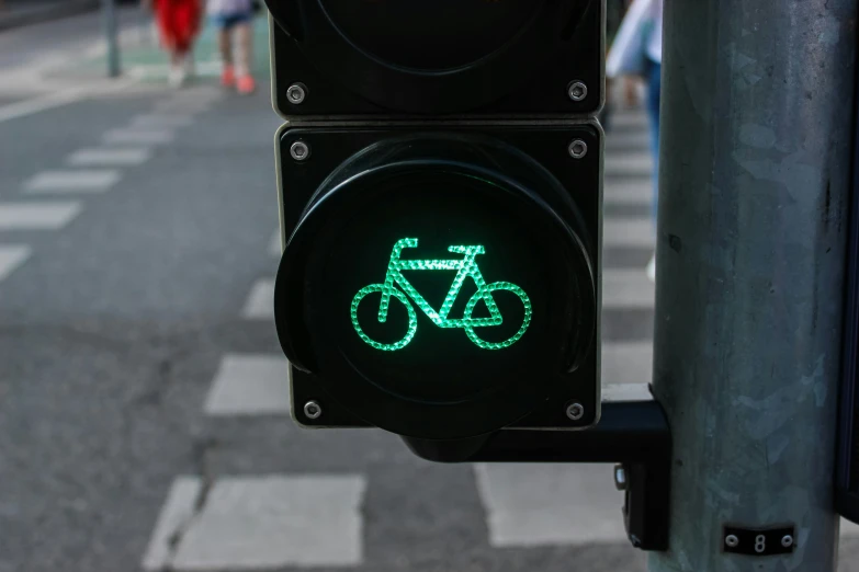 a street light with a glowing bicycle