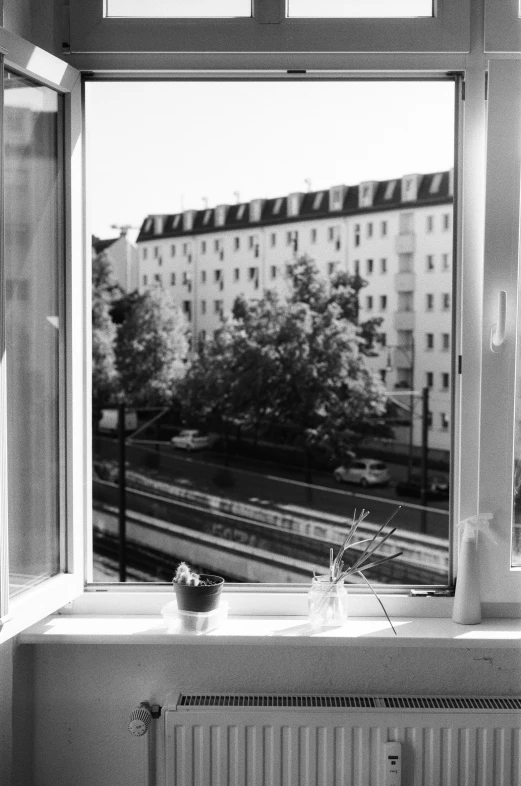 a large window with the view of a city building