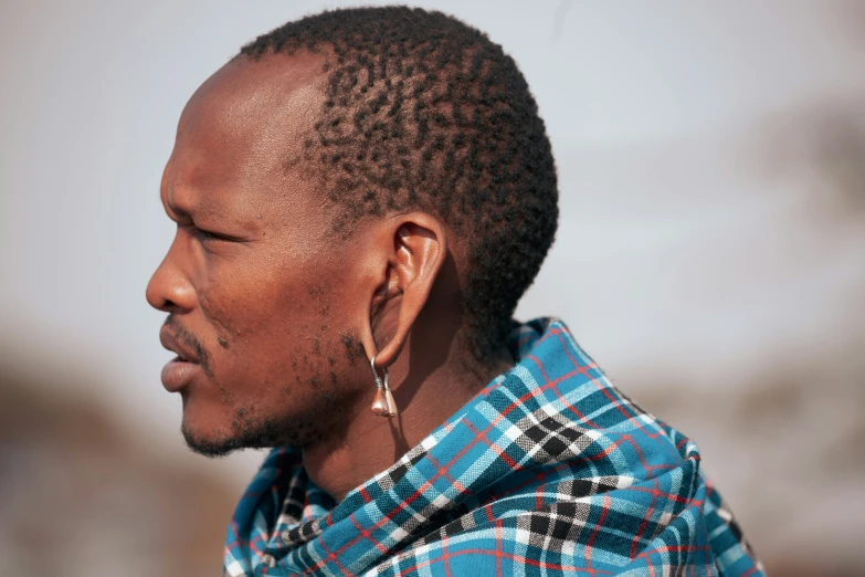 a person with a hair band wearing ear pieces